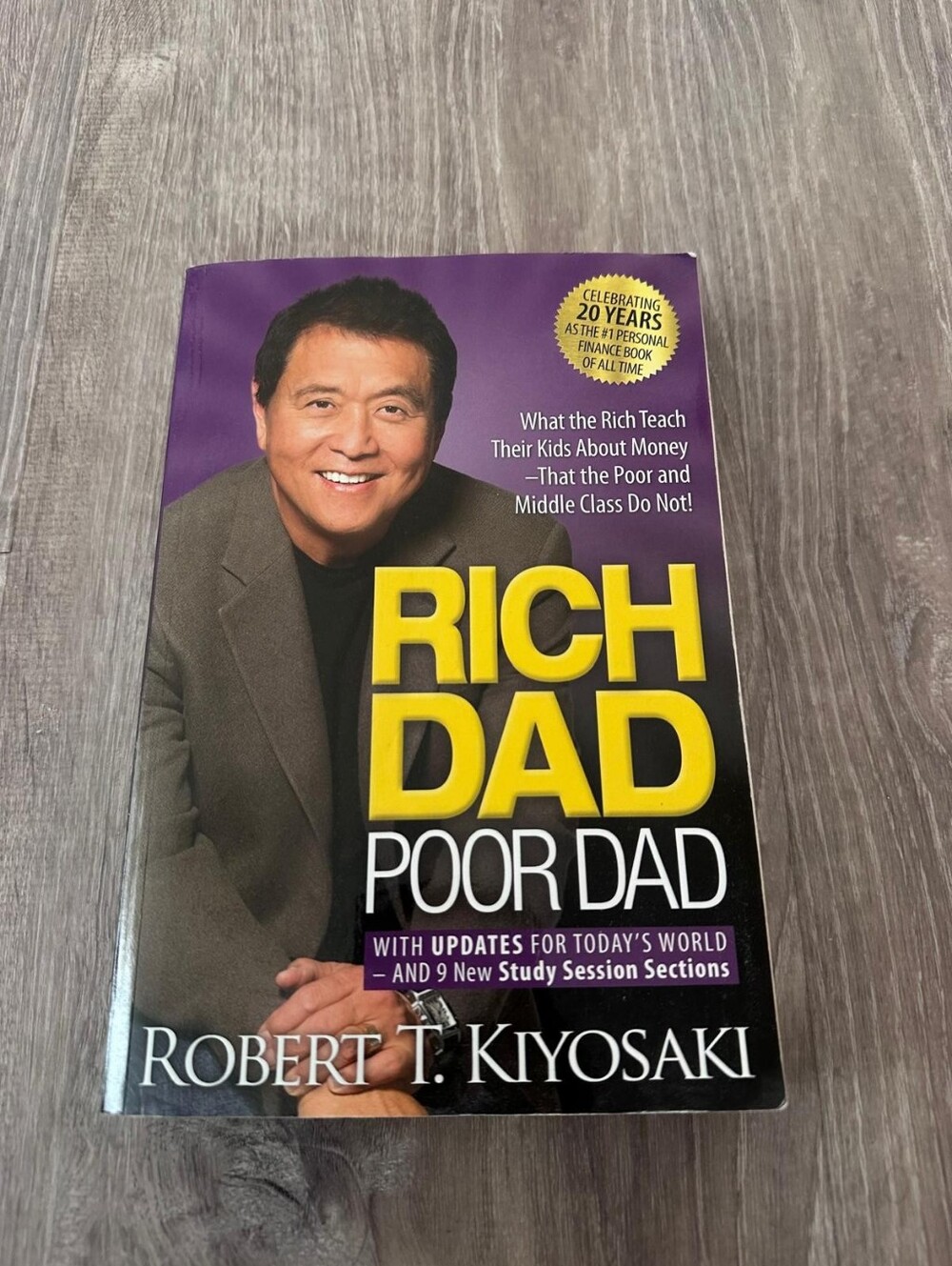 Rich Dad Poor Dad by Robert T. Kiyosaki - Yellow & Purple Cover